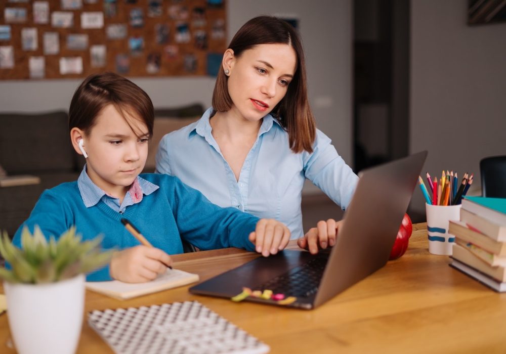 online-learning-using-laptop-teacher-and-boy-2021-09-15-18-33-56-utc-min.jpg